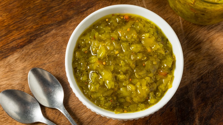 Bowl of sweet pickle relish with spoons