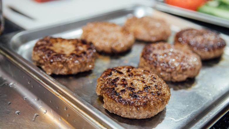 burger patties on metal pan