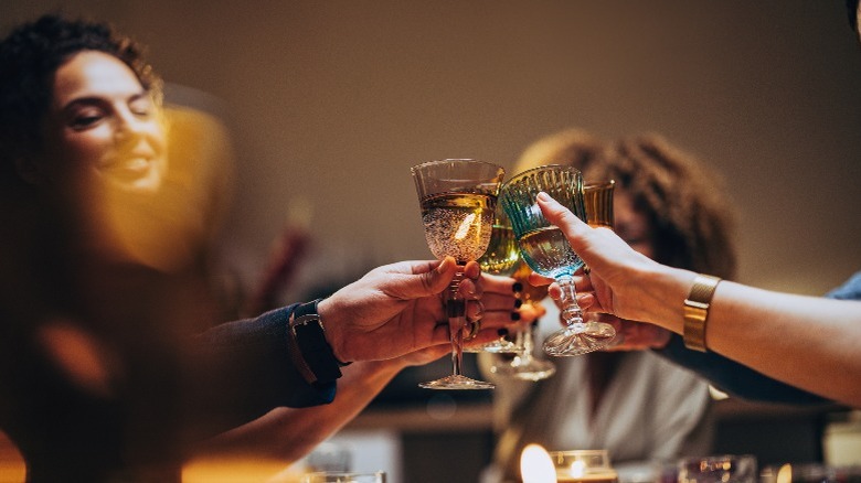 People toasting over dinner