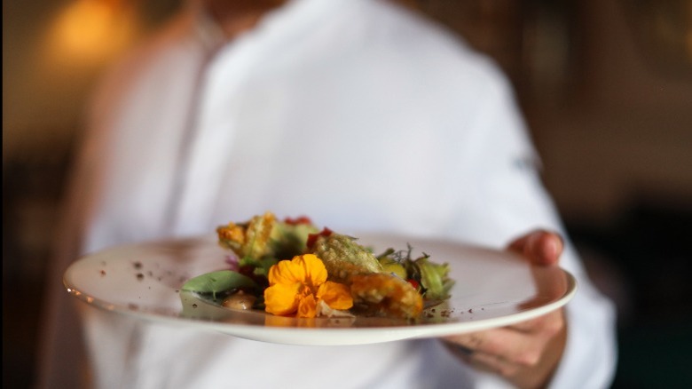 Chef holding a plate