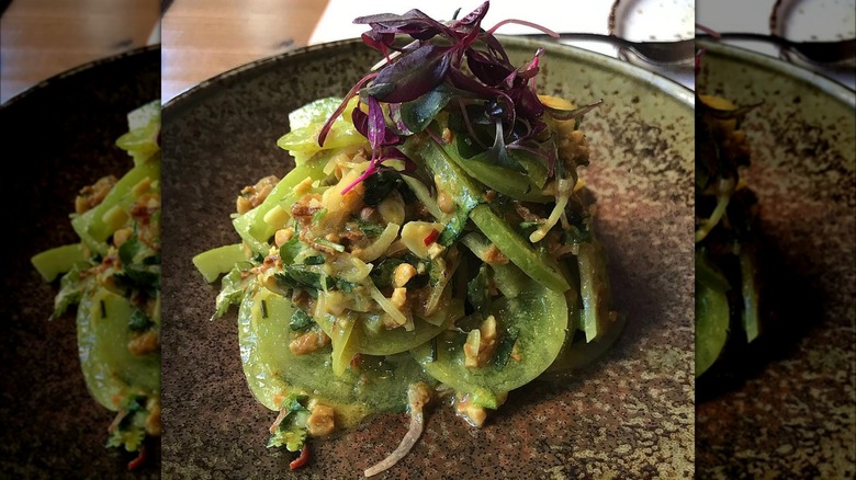 Green tomato salad on plate