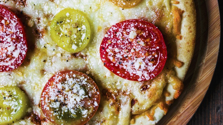 Pizza with multi-colored tomatoes