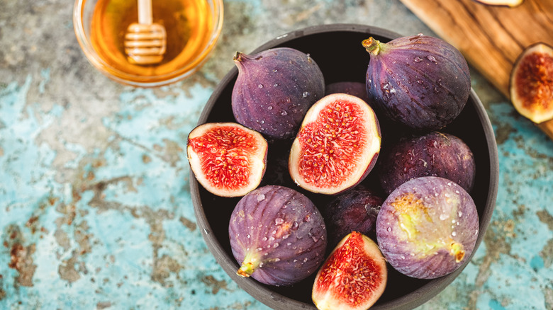 Bowl of figs on table