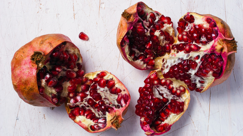 Pomegranate halves on gray background