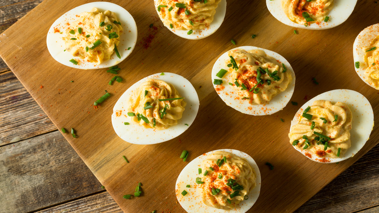 Deviled eggs on wooden platter