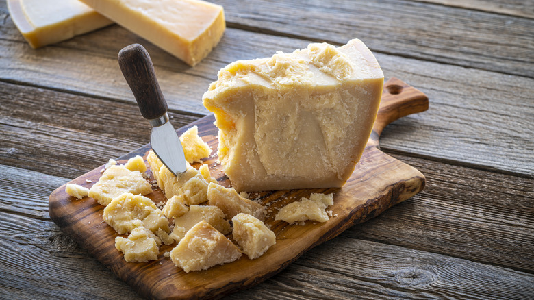 Parmesan cheese on cutting board