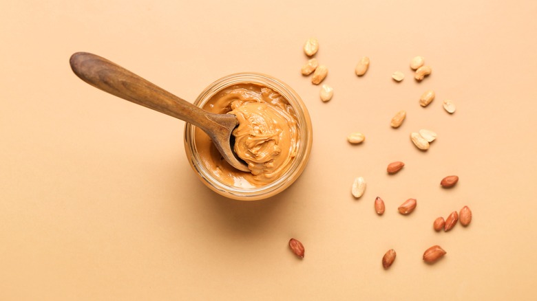 Peanut butter on pale brown background