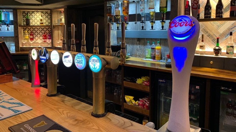 Selection of draft beers on tap at a bar