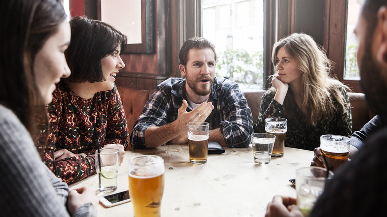 Group of friends drinking pints