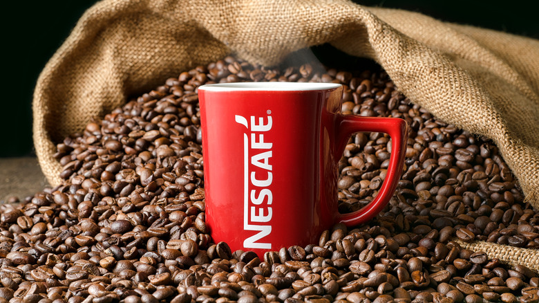Nescafé mug and coffee beans