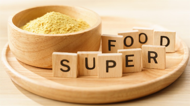 Nutritional yeast next to superfood sign