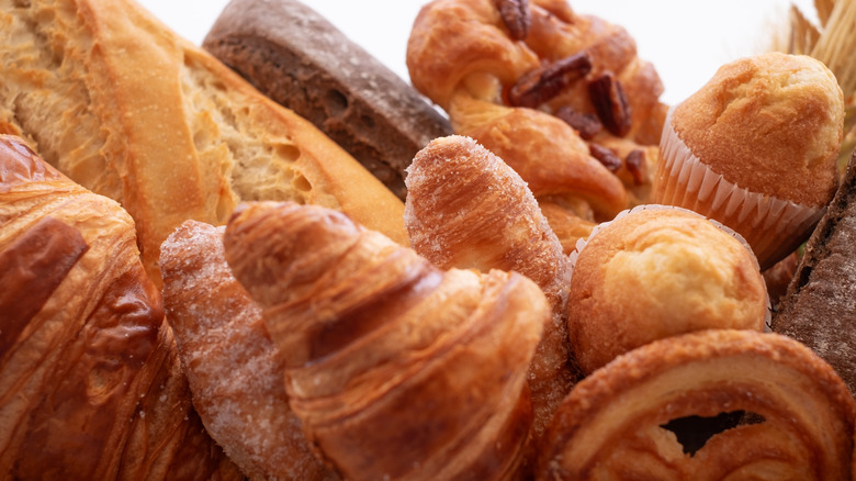 Close up of croissants, baguettes, and other baked goods