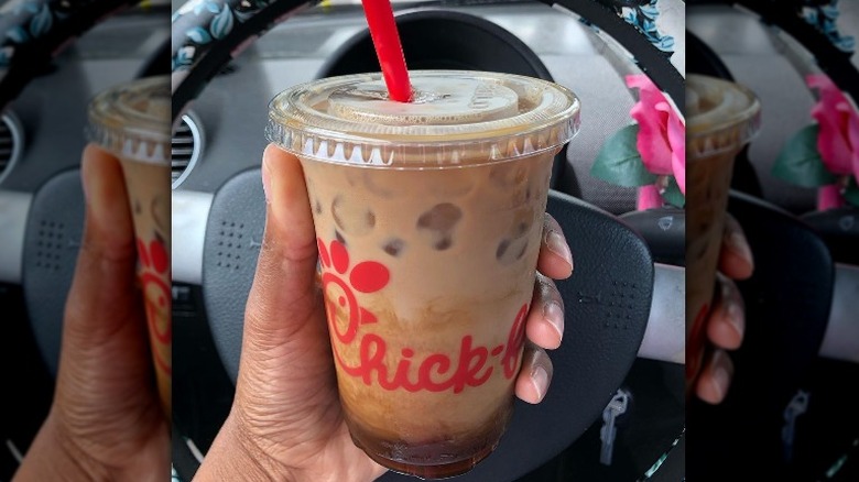 holding Chick-fil-A coffee