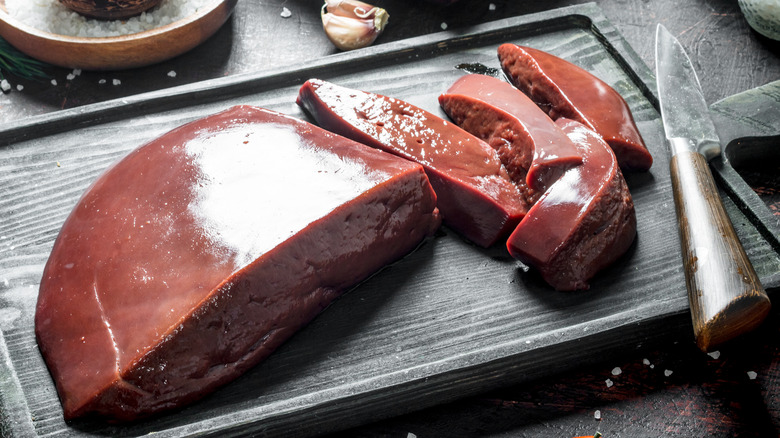 Raw liver slices cutting board