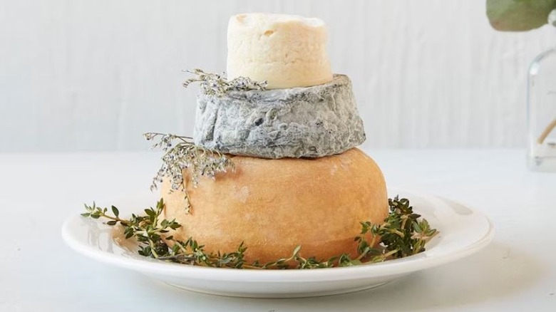 Murray's cheese tower plated with herbs