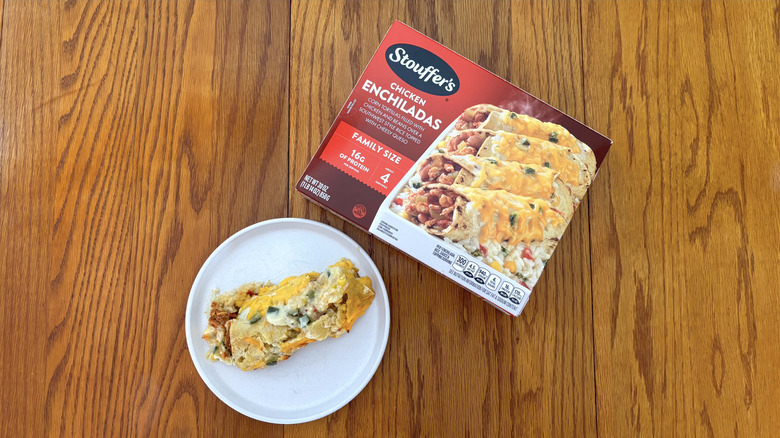 Stouffer's chicken enchiladas on white plate on wooden table