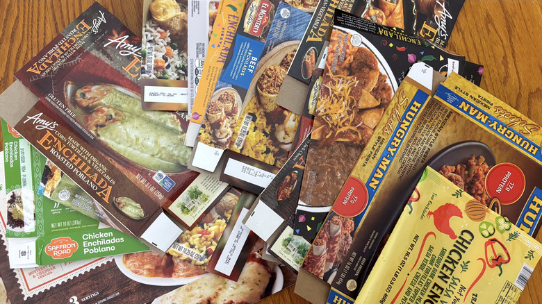 Frozen enchilada packages variety on wooden table