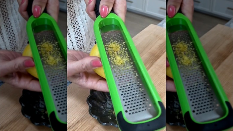 Grating a lemon with the grater held upside-down