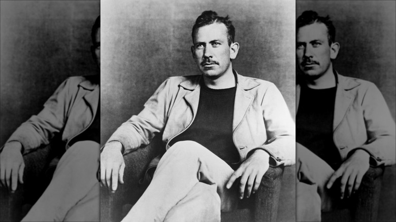 Black and white photo of young John Steinbeck sitting in chair