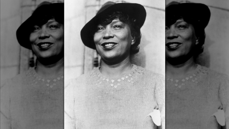 Black and white portrait of Zora Neale Hurston wearing hat