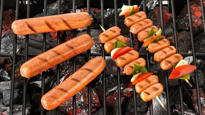 Hot dogs skewers on grill