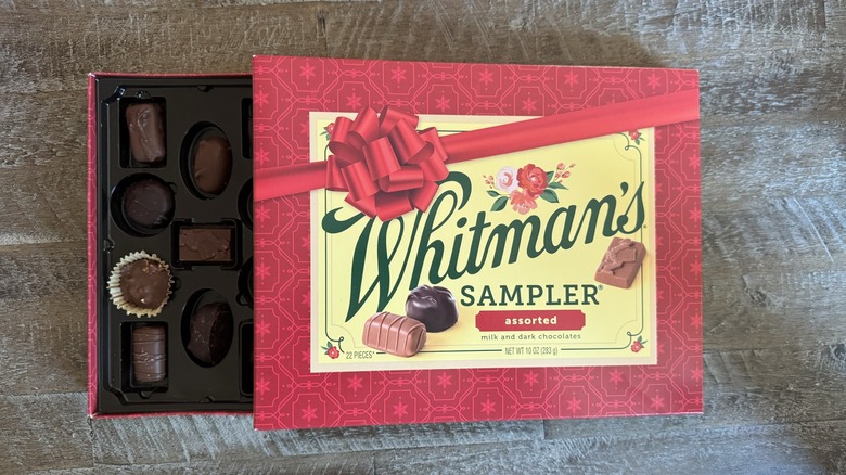 Whitman's chocolate sampler box opened up on table