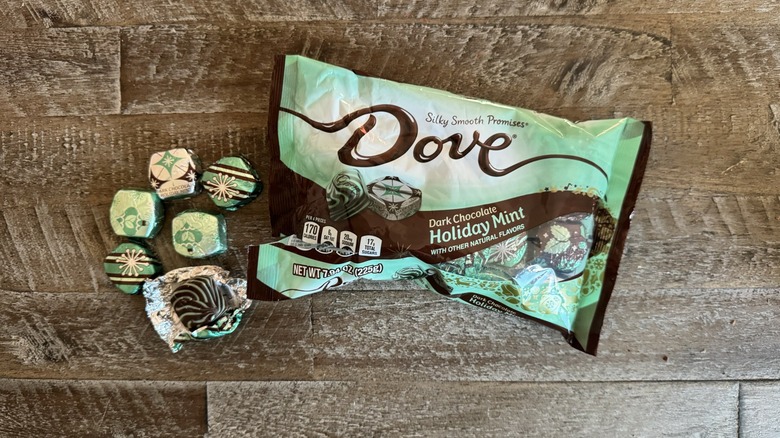 Dove chocolates and bag on table