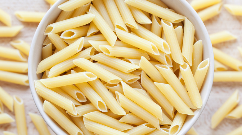 Dried penne in a bowl