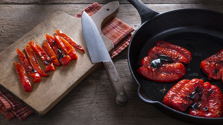 Red peppers roasting in a pan