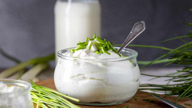 Bowl of sour cream with herbs