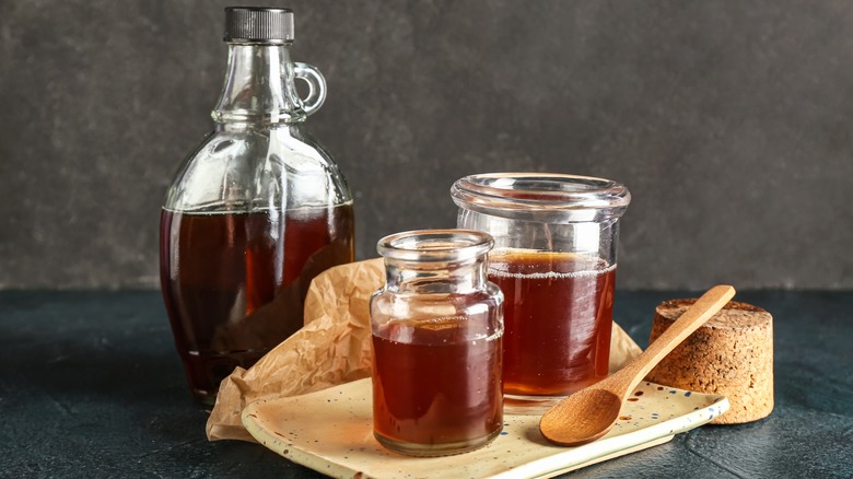 Maple syrup bottle and jars on board