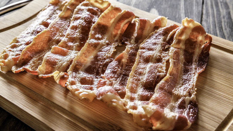 Crispy bacon on wooden board