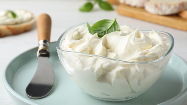 Basil cream cheese with knife