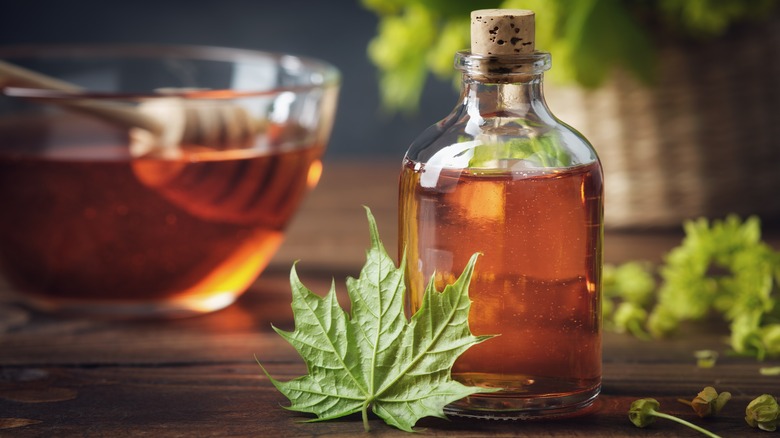 Maple syrup bottle with leaf