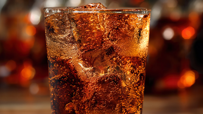 Cola soda in glass with ice