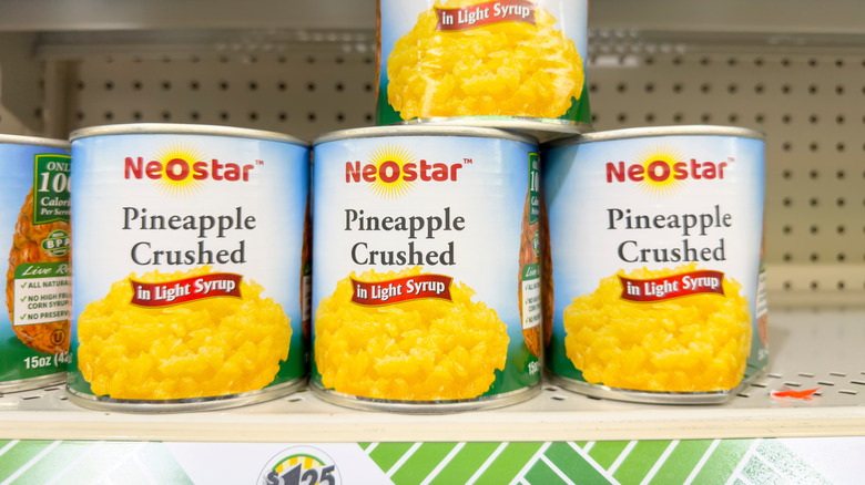 Cans of crushed pineapple at grocery store