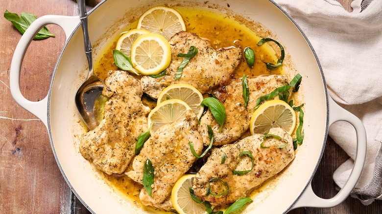 Top-down view of lemon chicken with basil 