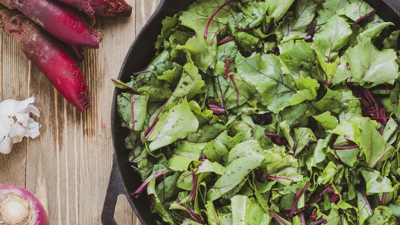 Beet greens in iron skillet