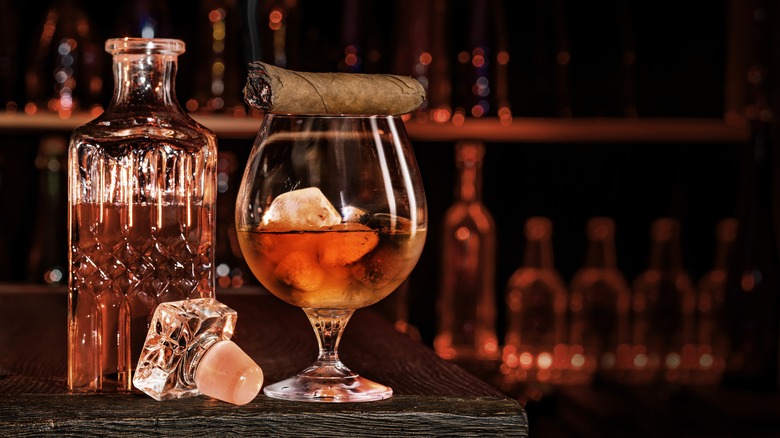 Glass of brandy with cigar