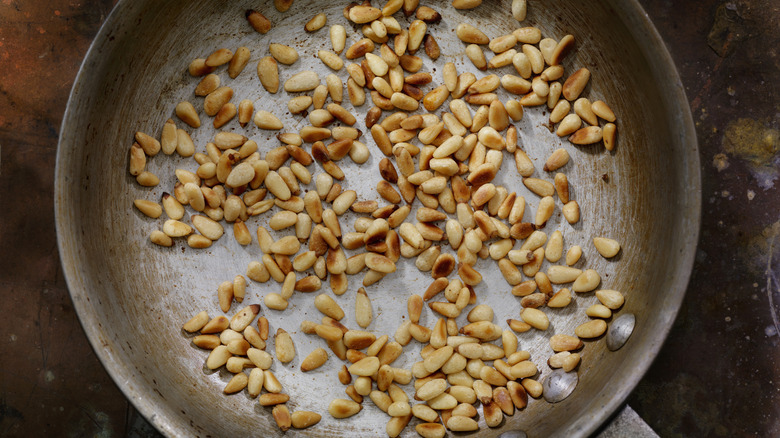 toasted pine nuts in pan