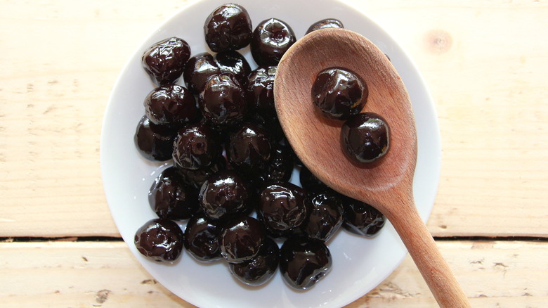 amarena cherries on a white plate