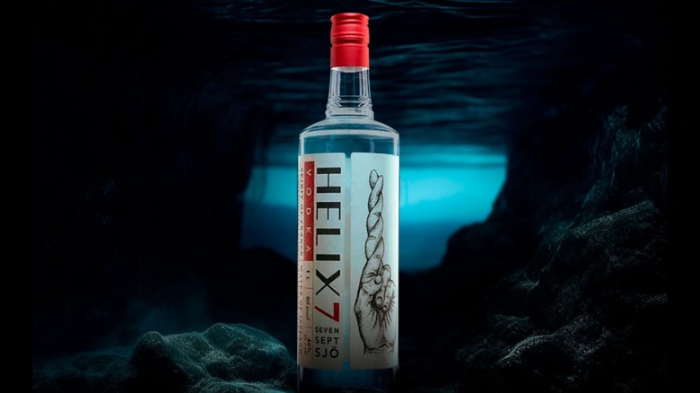 Bottle of Helix7 vodka in an underwater cave