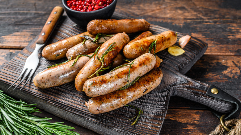 sausages resting on cutting board