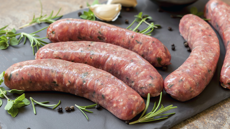 raw sausages on a slate