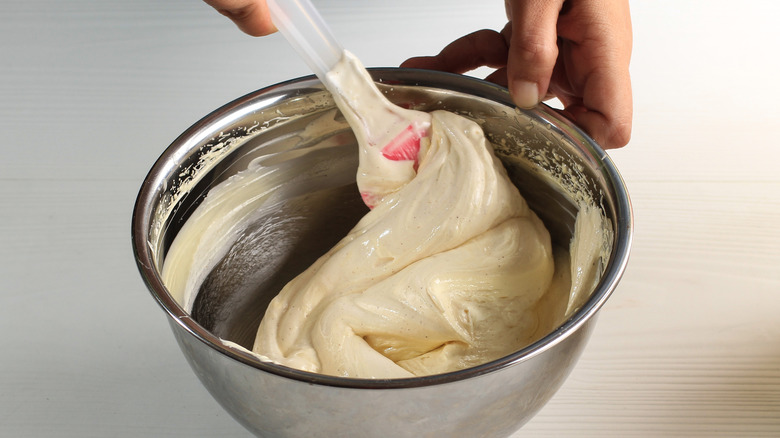 folding ingredients in bowl