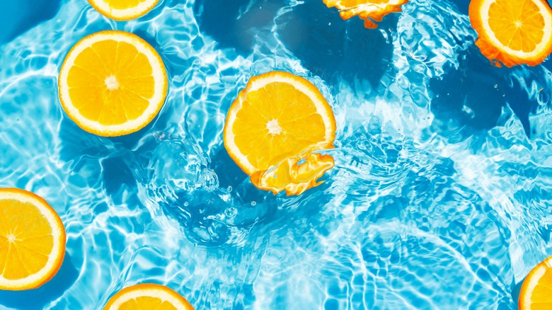 Oranges floating in water