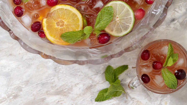 A punch bowl and cocktail