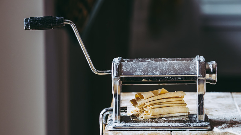 Rolling pasta dough with pin