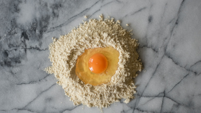 Flour well with eggs 