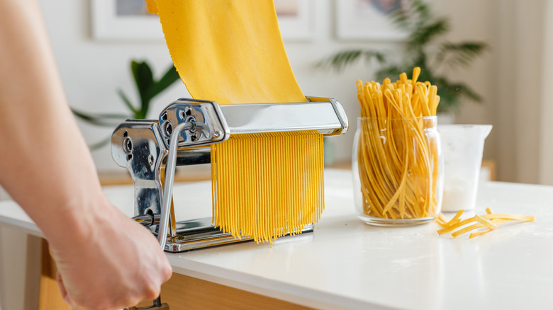 Rolling out pasta with machine